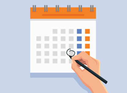 Person prioritizing workload by organizing deadlines on a calendar